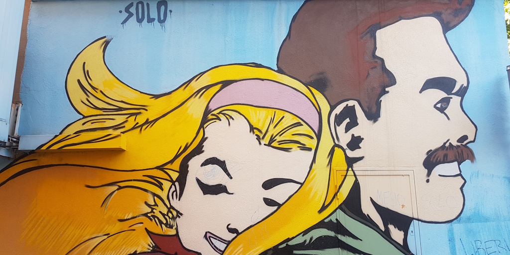 Murales di SOLO con donna e uomo
